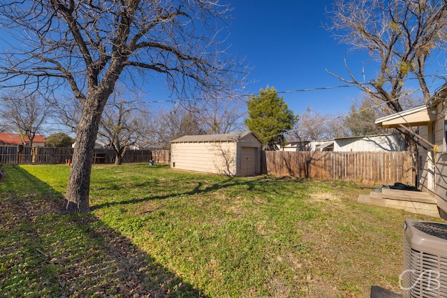 view of yard featuring a shed and central air condition unit