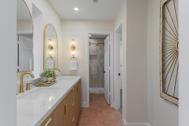 bathroom with tile patterned flooring, vanity, and a shower with shower door