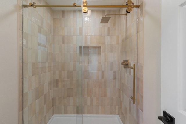 bathroom with a shower with shower door