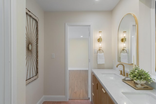 bathroom featuring vanity and hardwood / wood-style flooring