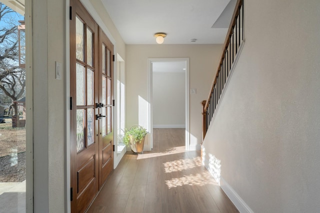 entrance foyer featuring hardwood / wood-style flooring and a wealth of natural light