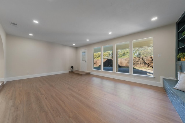 unfurnished living room featuring light wood-type flooring