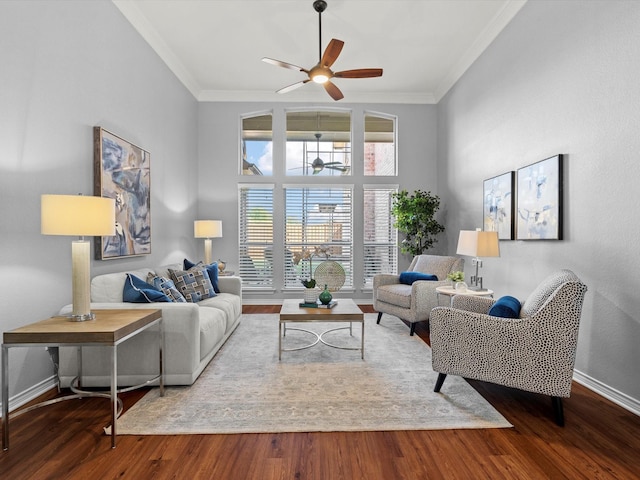 living room with hardwood / wood-style flooring, ornamental molding, and ceiling fan