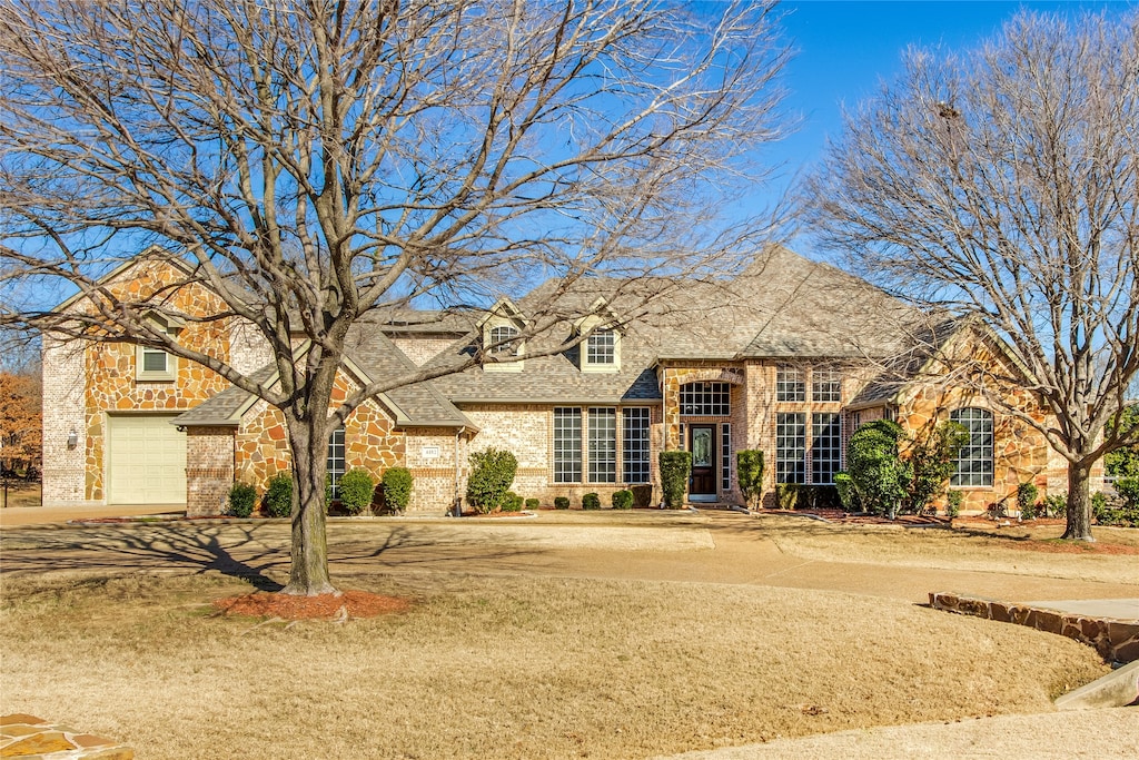 english style home with a garage