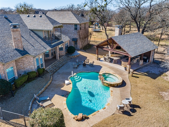 view of pool featuring a gazebo, a patio area, an in ground hot tub, and a bar