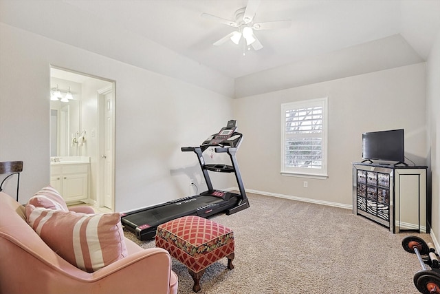 exercise room featuring light colored carpet and ceiling fan