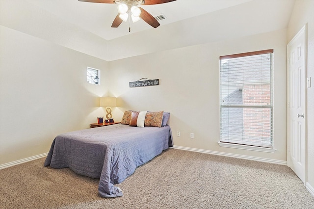 bedroom with multiple windows, carpet, and ceiling fan