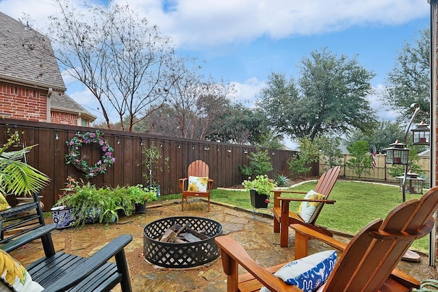 view of patio / terrace featuring an outdoor fire pit