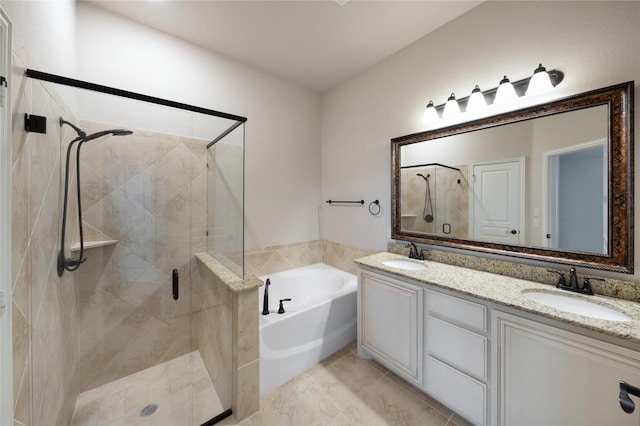 bathroom featuring tile patterned flooring, vanity, and separate shower and tub