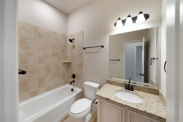 full bathroom featuring tiled shower / bath combo, vanity, and toilet