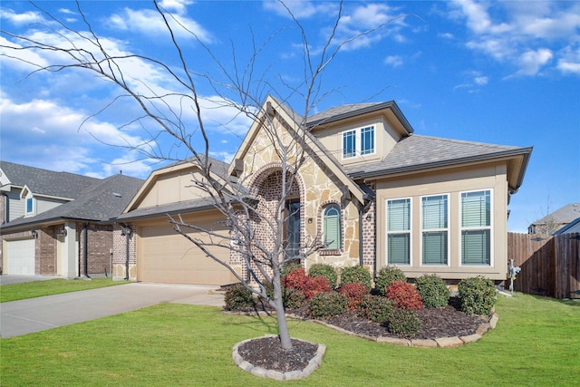 view of front of home featuring a garage and a front lawn