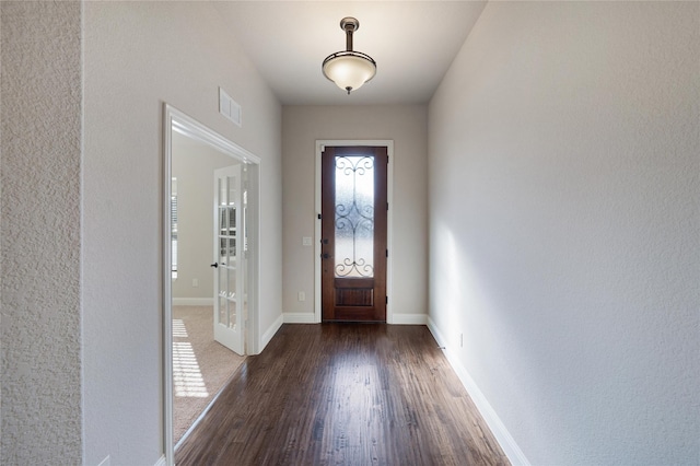 entryway with dark hardwood / wood-style floors