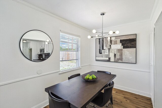 kitchen with sink, stainless steel appliances, dark hardwood / wood-style floors, white cabinets, and a tiled fireplace