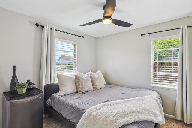 bedroom featuring carpet floors, a closet, and ceiling fan