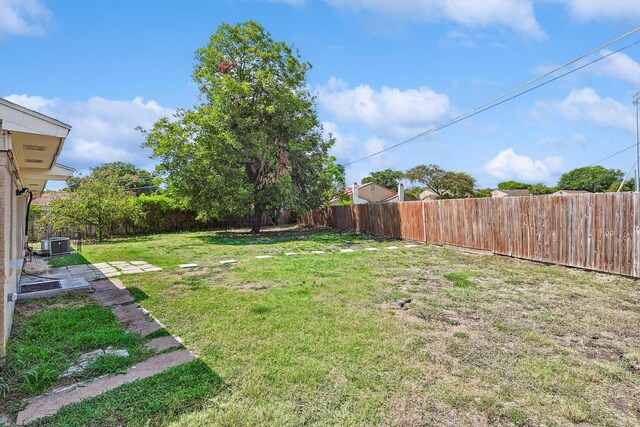 ranch-style house with a garage and a front lawn