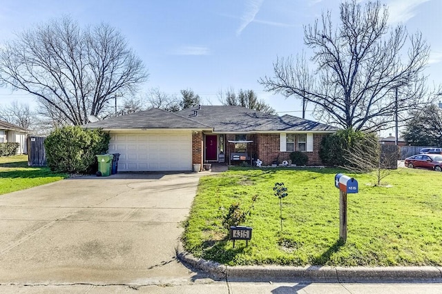 ranch-style house featuring a front lawn and a garage