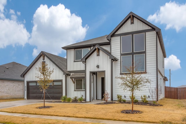 modern farmhouse style home featuring a garage and a front yard