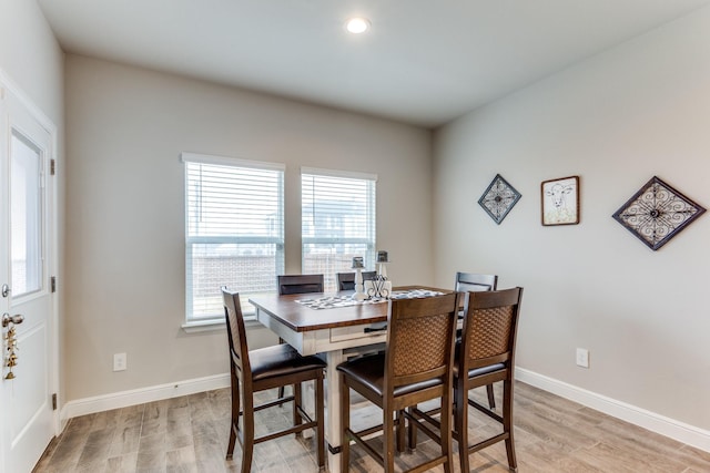 dining space featuring light hardwood / wood-style floors and a wealth of natural light