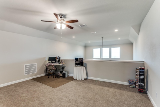 unfurnished office featuring light colored carpet and ceiling fan