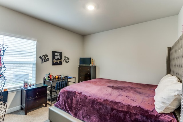 bedroom with light carpet