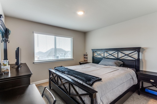 bedroom featuring carpet