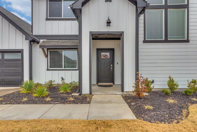 view of exterior entry featuring a garage