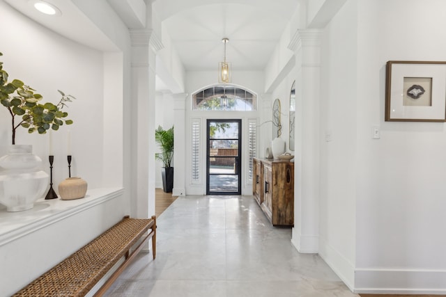 entrance foyer featuring decorative columns