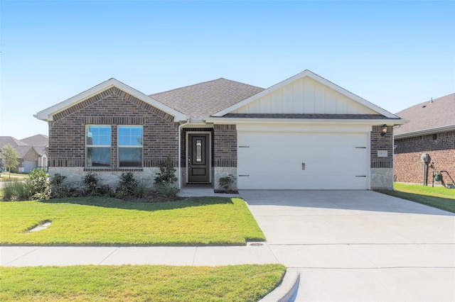 ranch-style home with an attached garage, brick siding, concrete driveway, board and batten siding, and a front yard