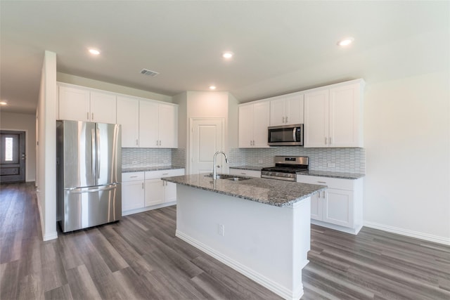 kitchen featuring stainless steel appliances, sink, and white cabinets