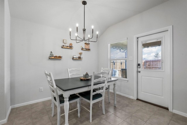 dining space featuring lofted ceiling, baseboards, a notable chandelier, and light tile patterned flooring