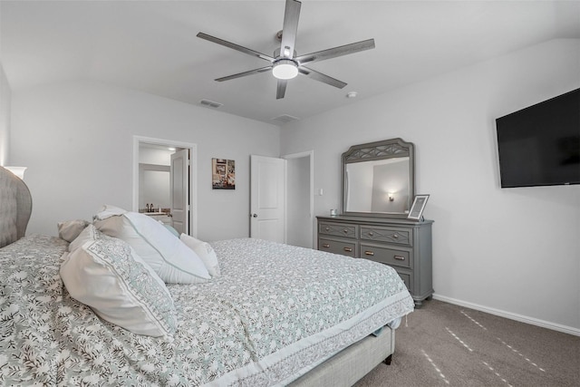 carpeted bedroom featuring baseboards, visible vents, vaulted ceiling, and a ceiling fan