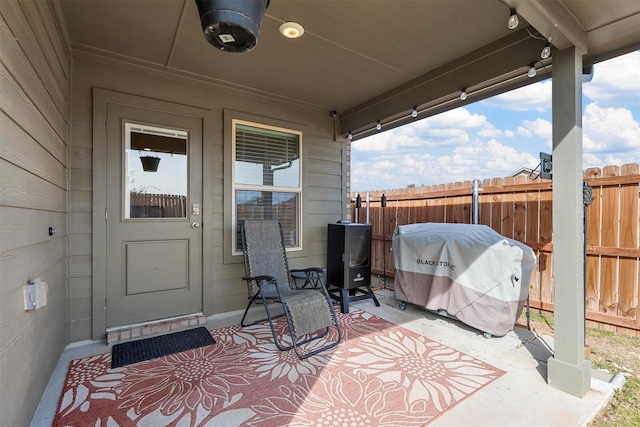 view of patio / terrace featuring fence and grilling area