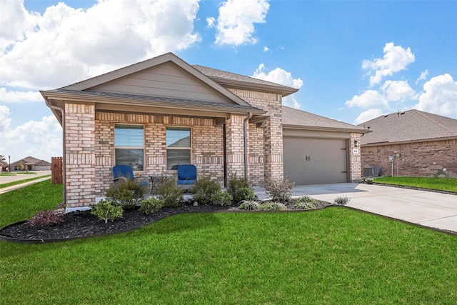 view of front of house featuring concrete driveway, brick siding, an attached garage, and a front yard