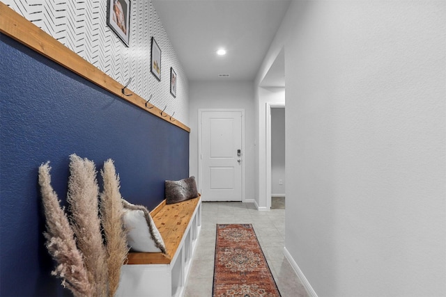 mudroom featuring tile patterned flooring and baseboards