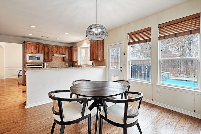 dining room with light wood-type flooring