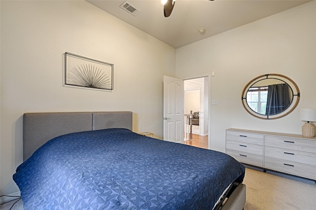 bedroom featuring ceiling fan and light colored carpet