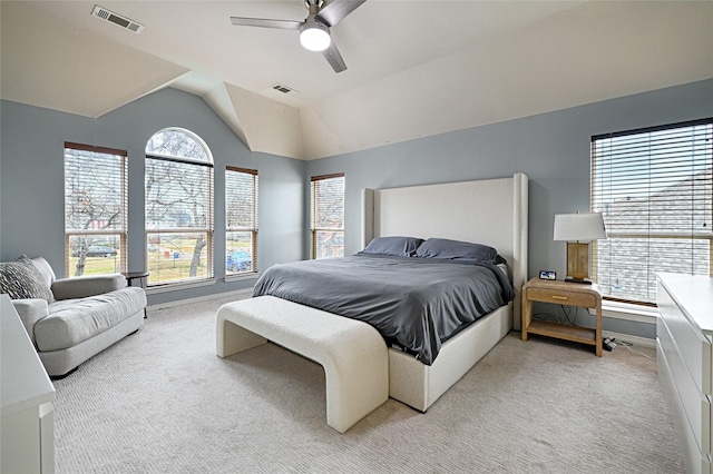 bedroom with light carpet, vaulted ceiling, and ceiling fan