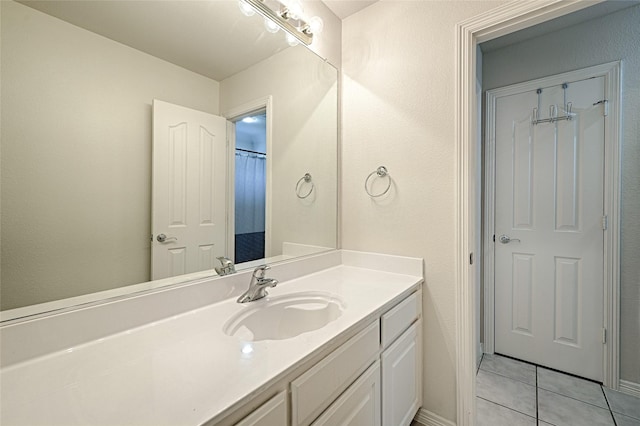 bathroom featuring vanity, tile patterned floors, and a shower with curtain