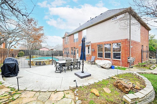 view of patio featuring a fenced in pool