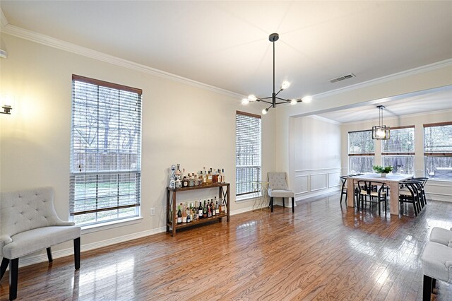 home office with crown molding, light hardwood / wood-style flooring, and french doors