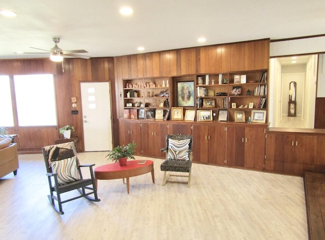 625 E Whitney St, Hamilton, TX 76531 - living room with light wood-type flooring, ceiling fan, wood walls, recessed lighting, and built in features