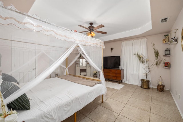 bedroom with ceiling fan and tile patterned flooring