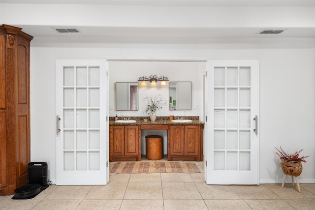 interior space featuring tile patterned flooring and vanity