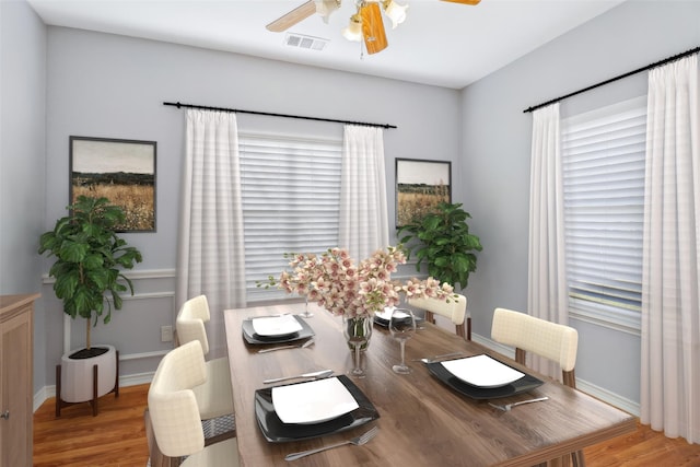 dining area featuring a wealth of natural light, ceiling fan, and light wood-type flooring