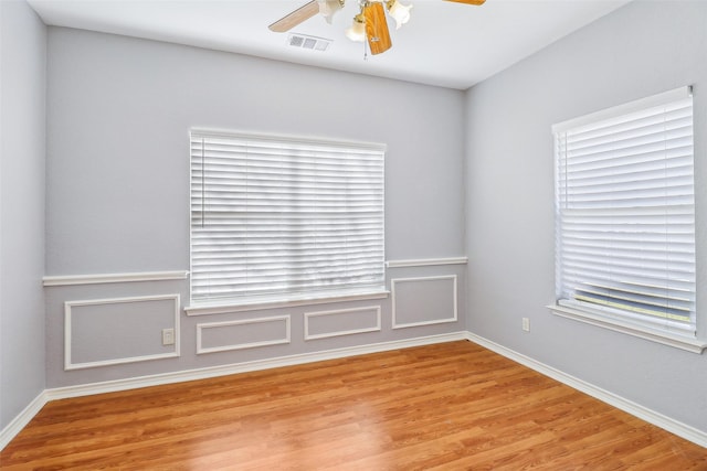 empty room featuring ceiling fan and light hardwood / wood-style flooring