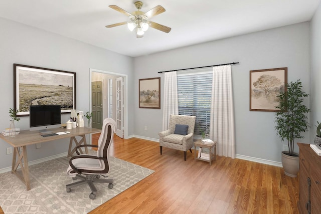 office area with ceiling fan and light wood-type flooring