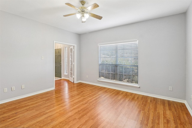 unfurnished room featuring light hardwood / wood-style floors and ceiling fan