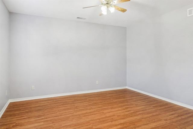 unfurnished room with ceiling fan and light hardwood / wood-style floors