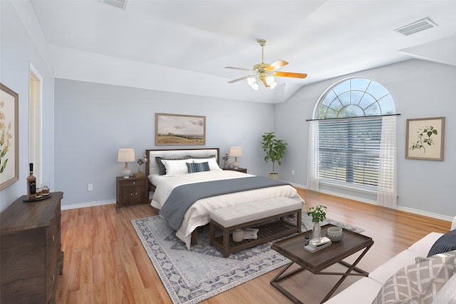 bedroom with vaulted ceiling, ceiling fan, and light hardwood / wood-style floors