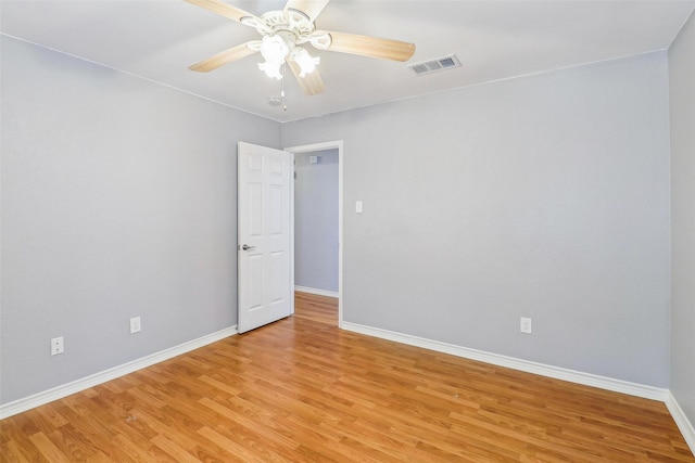 unfurnished room with ceiling fan and light wood-type flooring